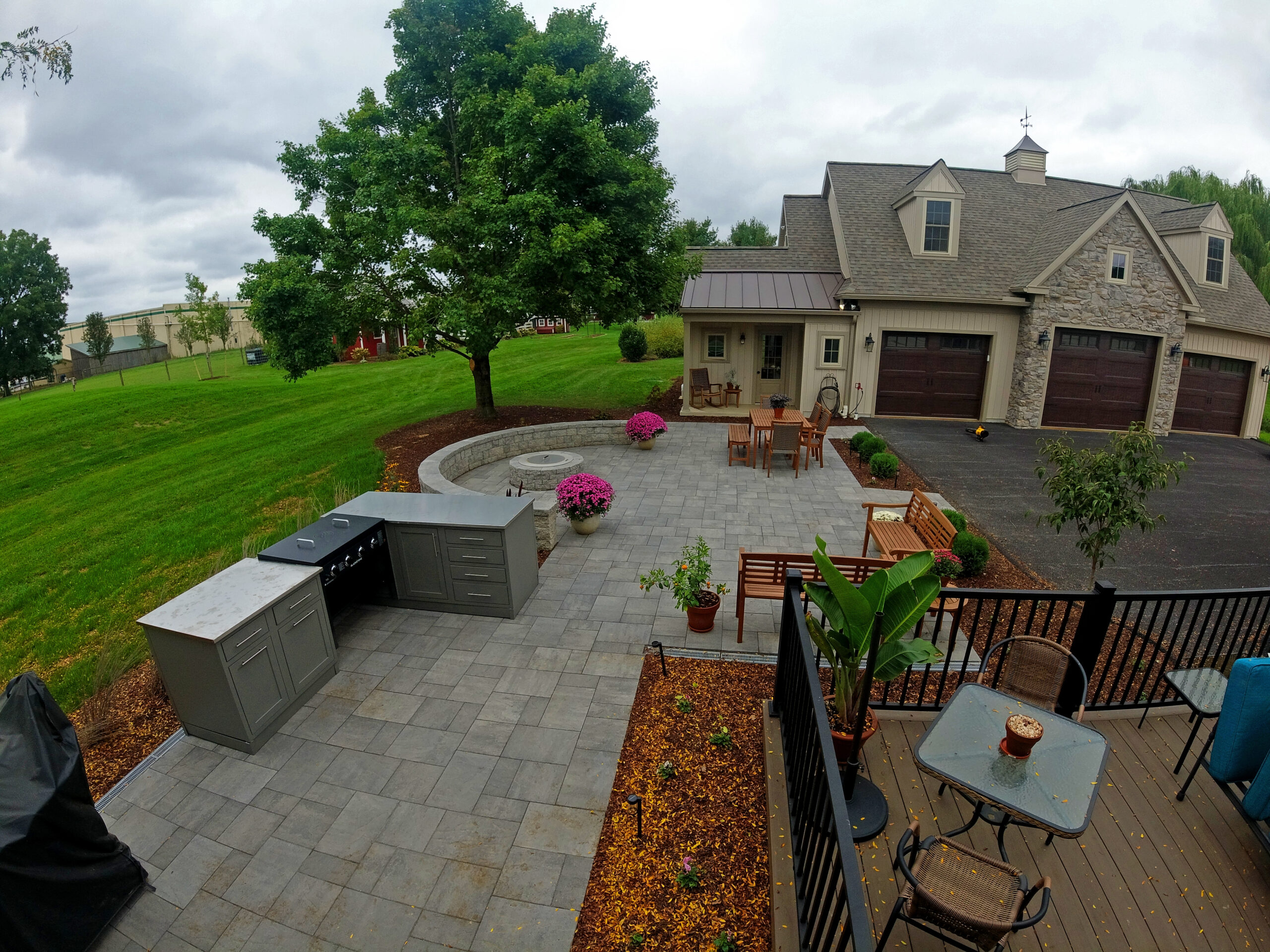 Paver Patio, Outdoor Kitchen, fire pit, seating wall, landscaping