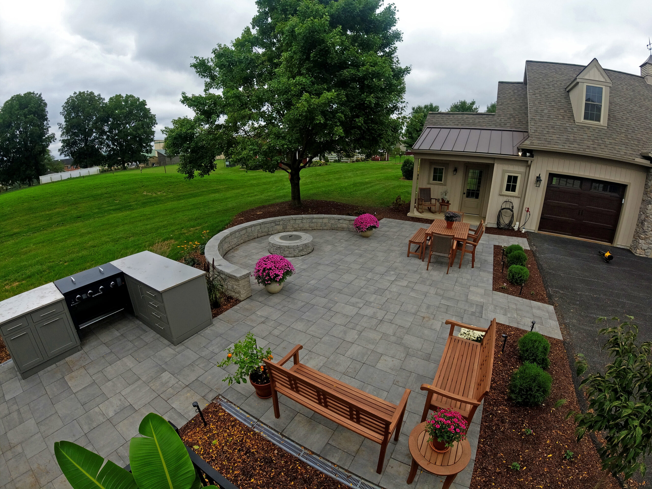 Paver Patio, Outdoor Kitchen, fire pit, seating wall, landscaping