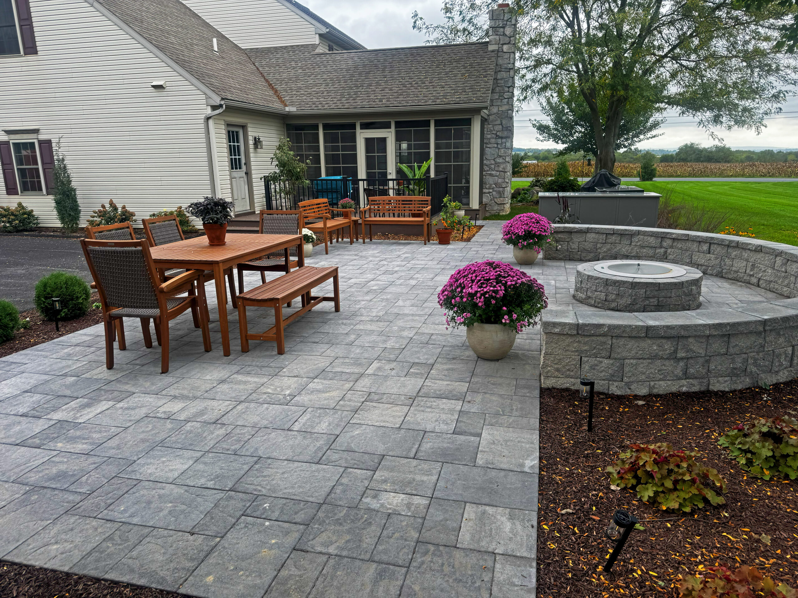 Paver Patio, Outdoor Kitchen, fire pit, seating wall, landscaping