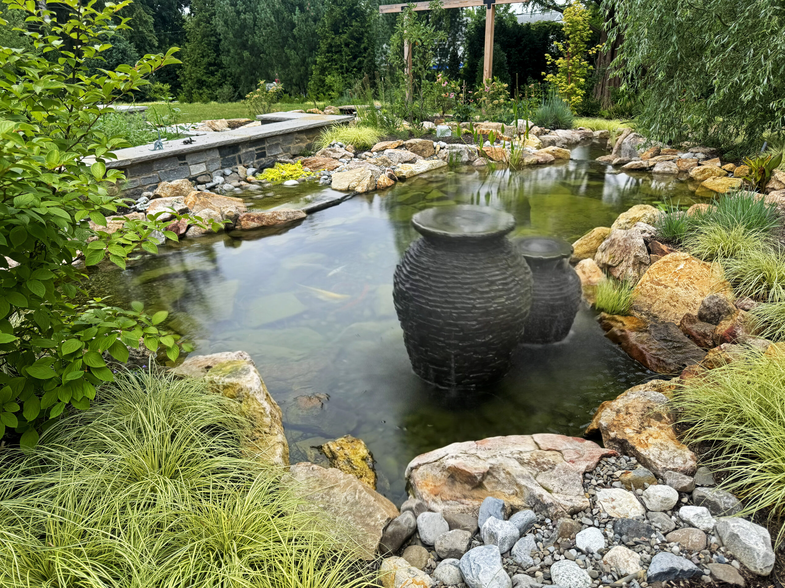 Mini Natural Swimming Pond with Stream and Waterfalls and bubbling urns